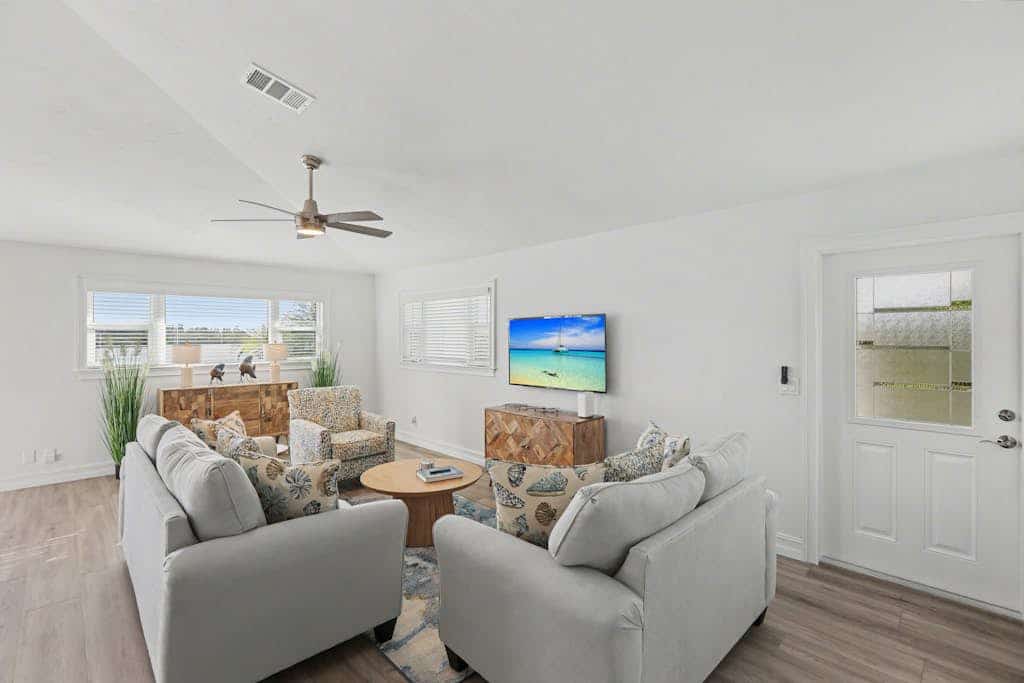 Immaculate bay front home w/in ground pool, spa, paver patio & porch