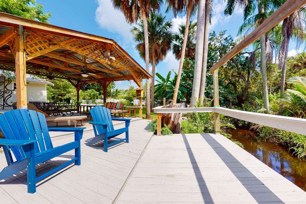 Riverfront dog-friendly cottages with kayaks, dock, patio, grill, & water views