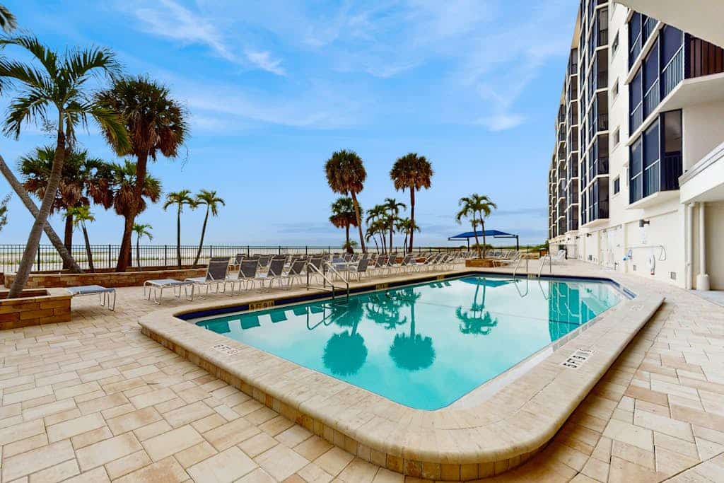 Beachfront condo with screened balcony, community pool, and internet
