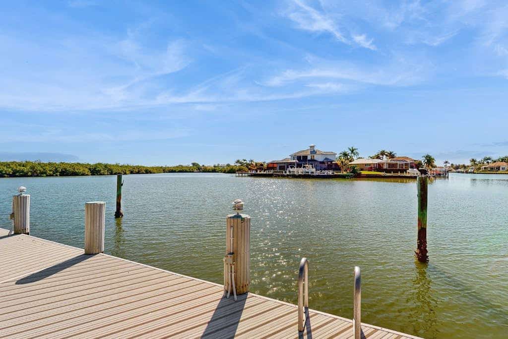 Spacious canal front home with private pool, dock & close to everything