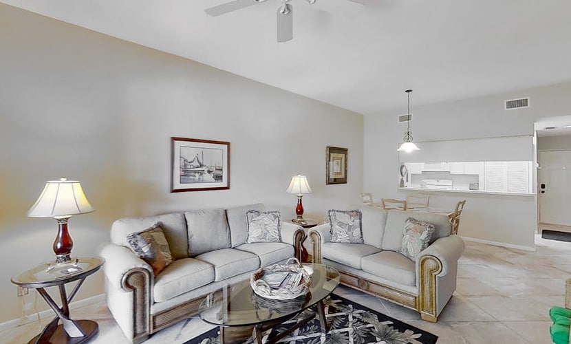 Gated resort community condo with water views, pool, hot tub, & balcony