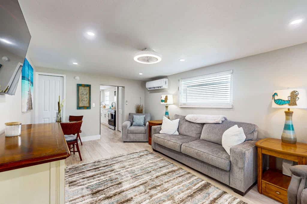 Canal front apartment with waterfront views, private patio, and yard
