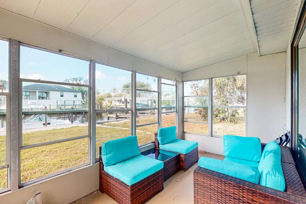 Canal front apartment with waterfront views, private patio, and yard