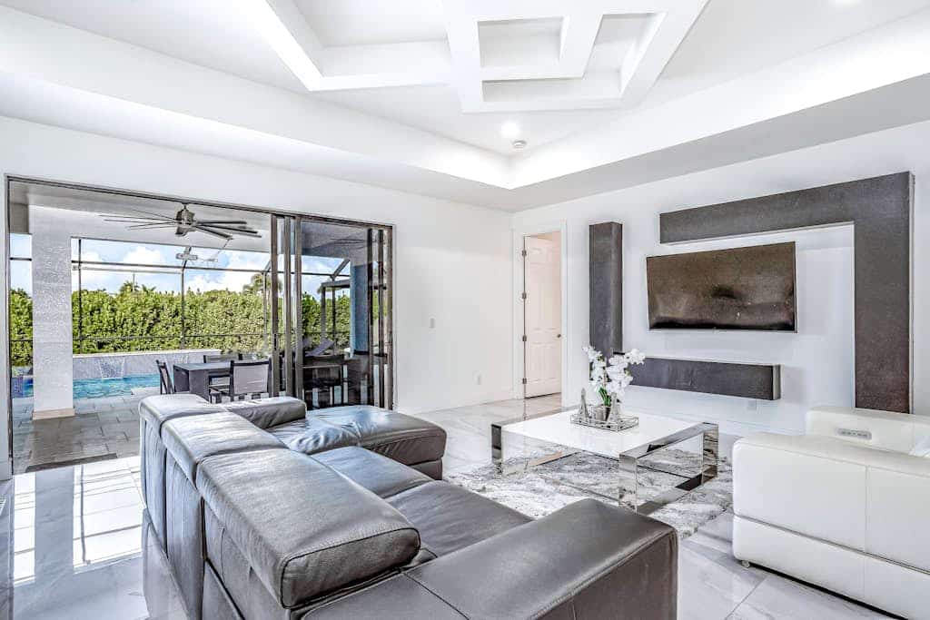 Dog-friendly home with outdoor kitchen, game room, cabana, pool spa & pool
