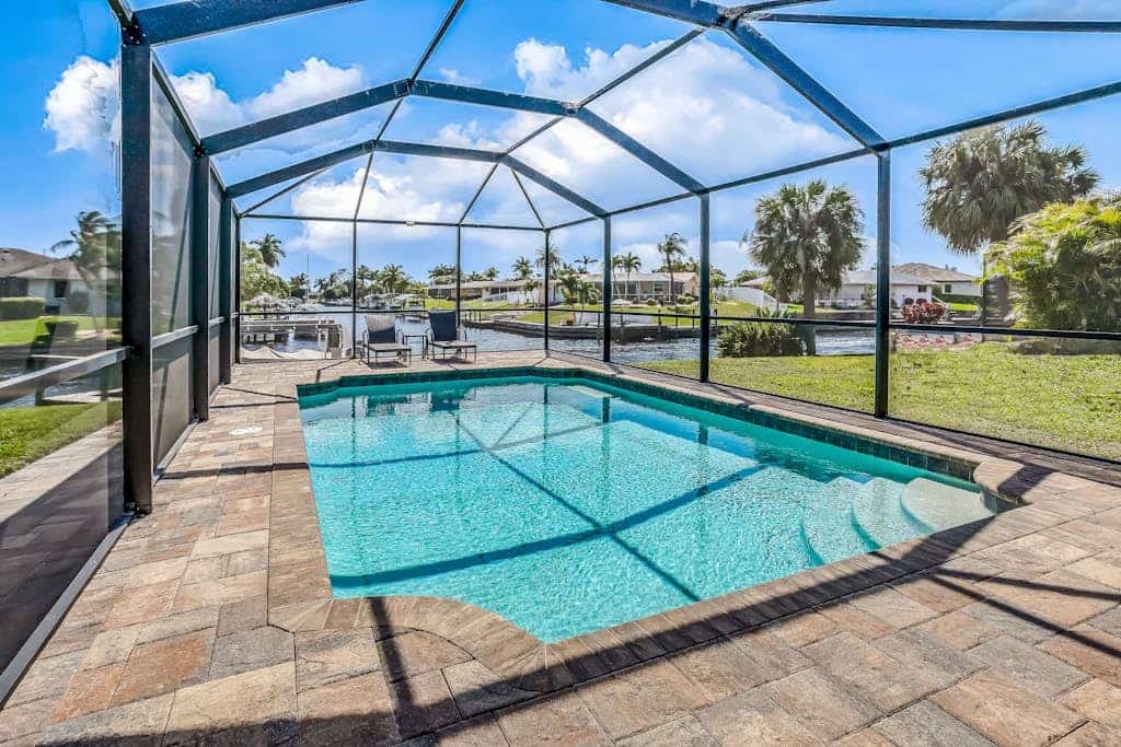 Canal-front with screened saltwater pool, dock & boat lift - updated interior