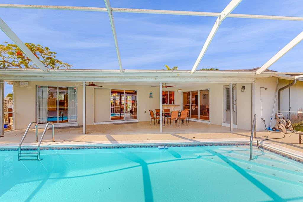 Canal-Front Getaway with Private Dock, Kayaks, Fishing Rods & Heated Pool