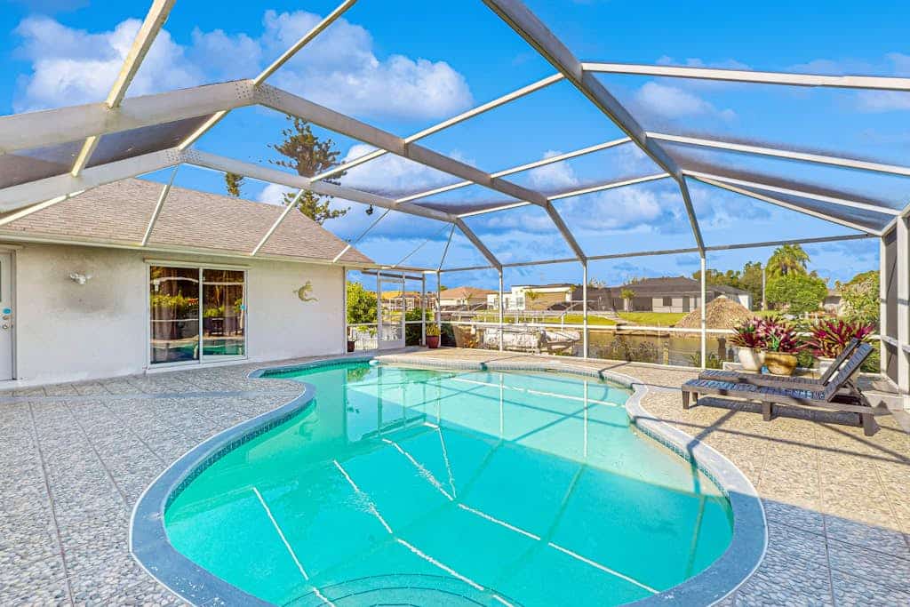 Canal-side gem with screened pool, boat dock & Gulf access - near dining