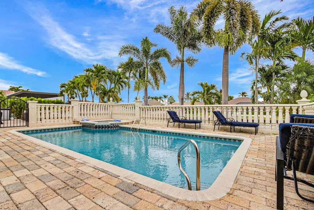 Striking European-style home w/ private pool, hot tub & river access via dock
