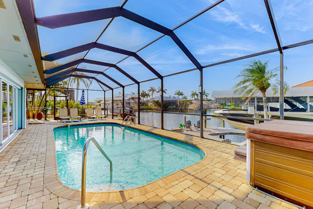 Dog-friendly tropical home on the canal w/ screened patio w/ pool & private dock
