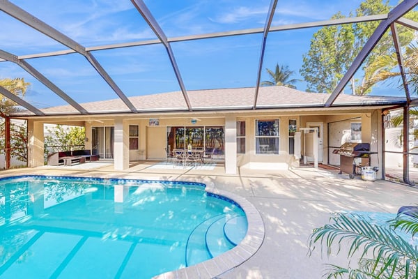 Luxury coastal retreat with office, lanai, pool, alfresco dining & tiki bar