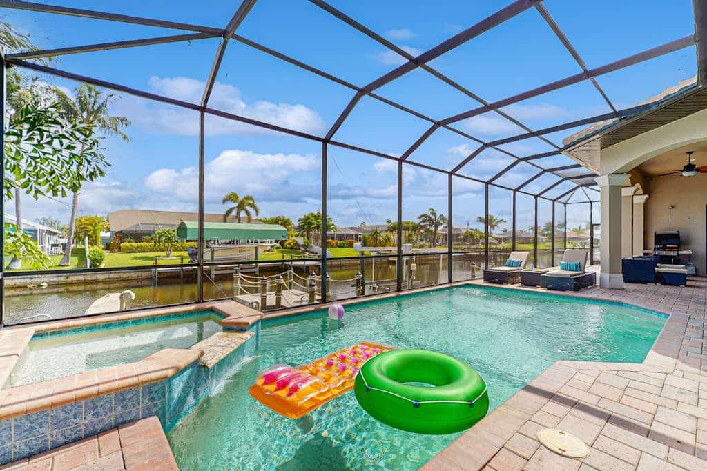 Dog-friendly home on the canal with AC & pool with spa - snowbird-friendly