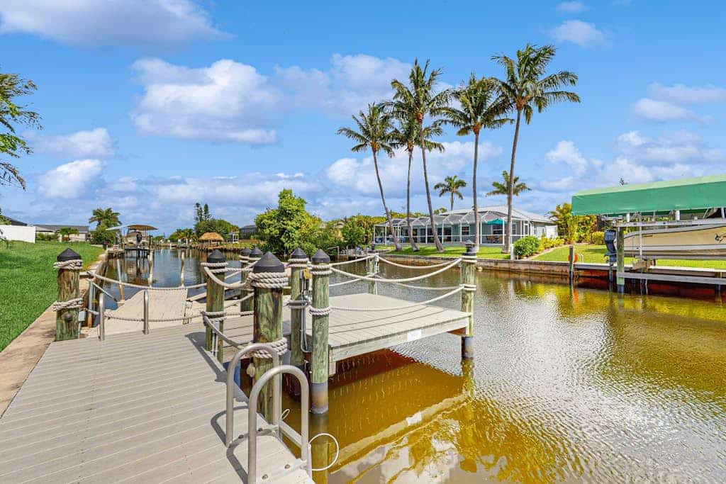 Dog-friendly home on the canal with AC & pool with spa - snowbird-friendly