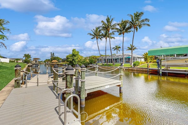 Dog-friendly home on the canal with AC & pool with spa - snowbird-friendly