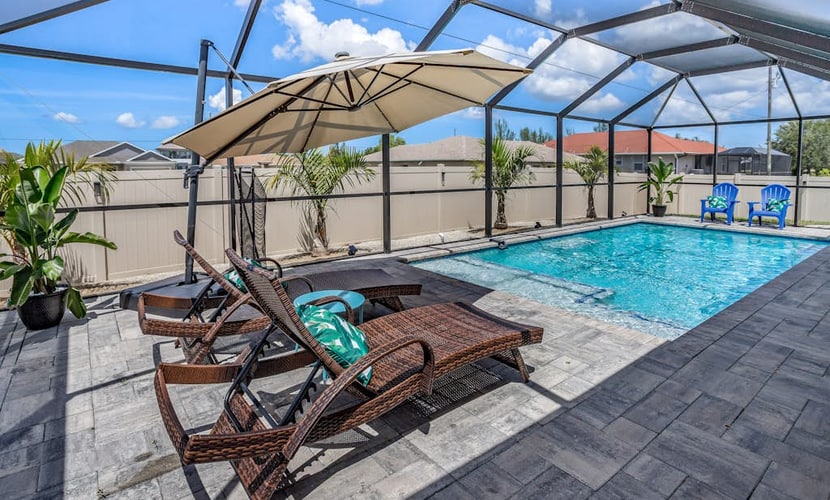 Private home with heated pool, screened lanai, grill, sun deck, & yard games