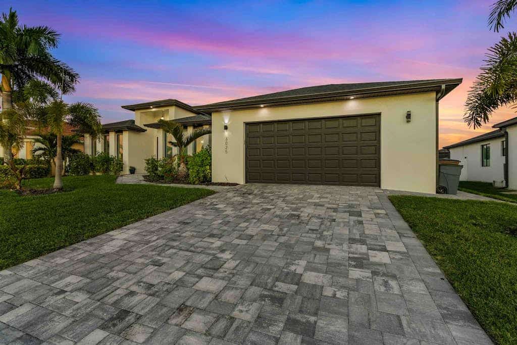 Luxury canal front home with heated pool, pool spa, grill, fireplace, W/D, & AC