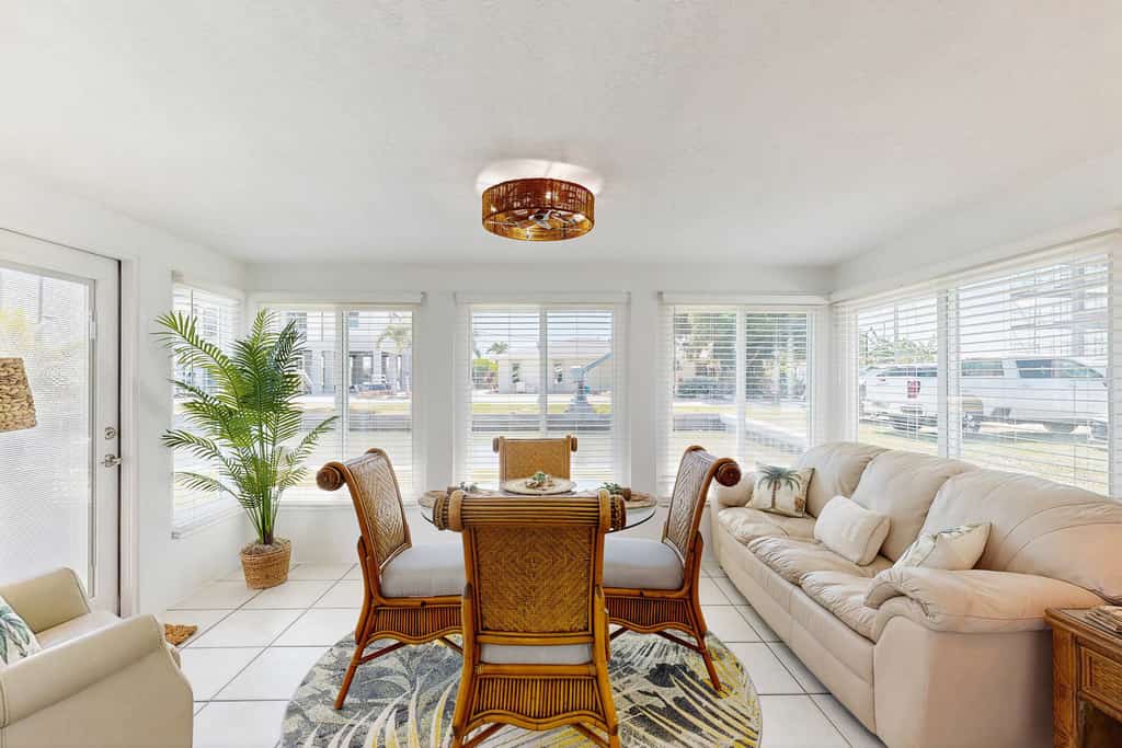 Waterfront home with canal access, patio, sun room, & central AC - near beach