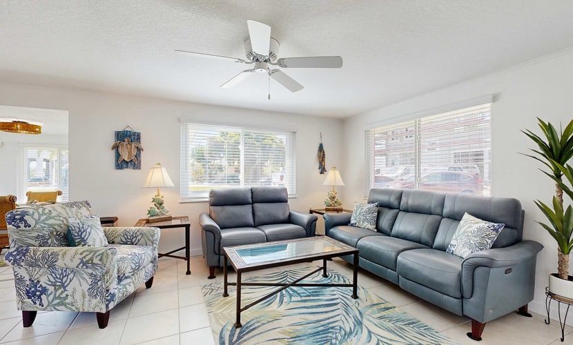 Waterfront home with canal access, patio, sun room, & central AC - near beach
