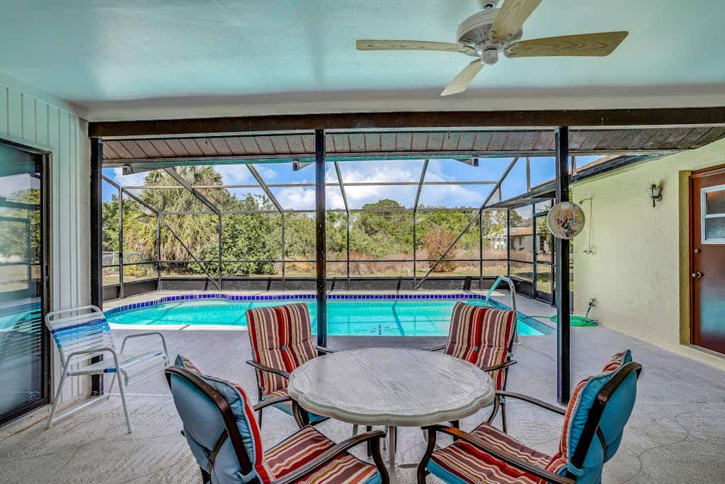 One-level home in quiet location with private pool, central AC & open layout