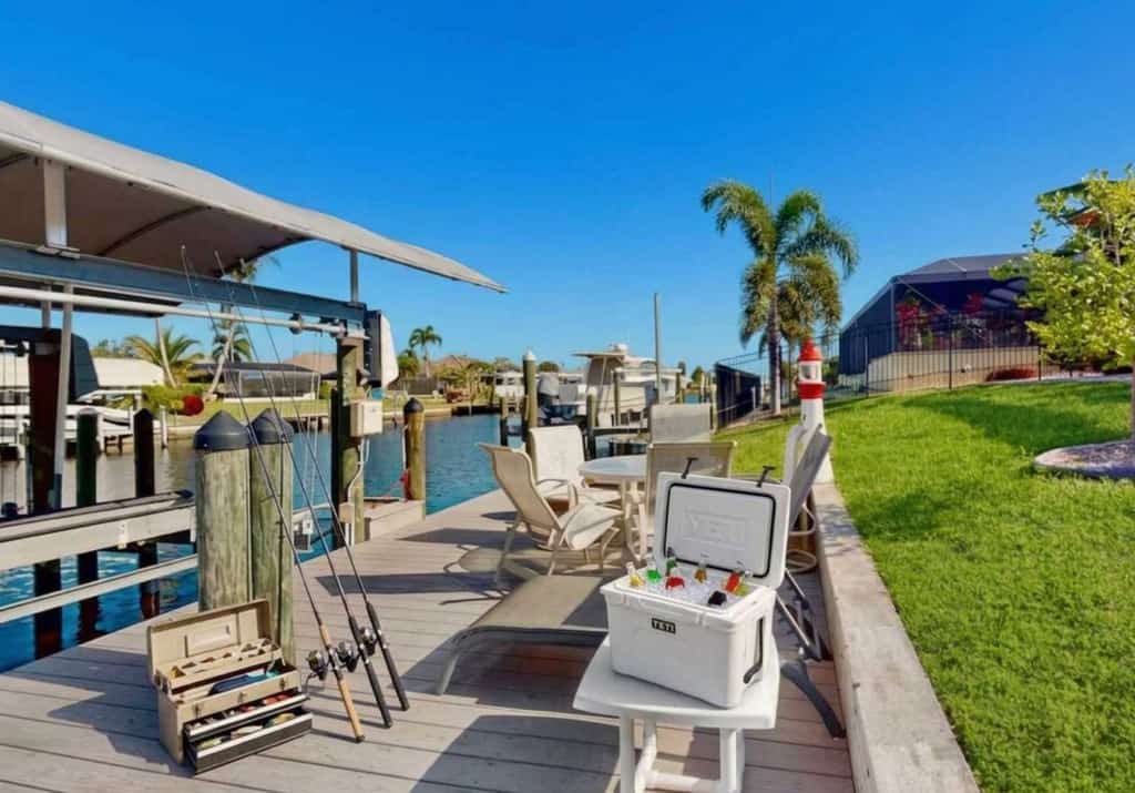 Waterfront home with saltwater pool, spacious outdoor area, and dock