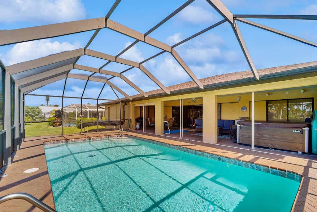 Canal front home with private pool, lanai, and washer and dryer.