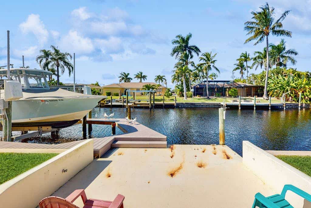 Canal front home with private pool, lanai, and washer and dryer.