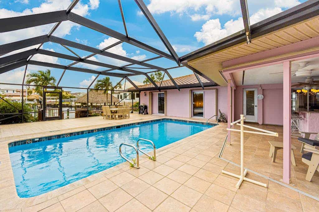 Gulf view home with heated pool, alfresco dining, dock, W/D, & AC