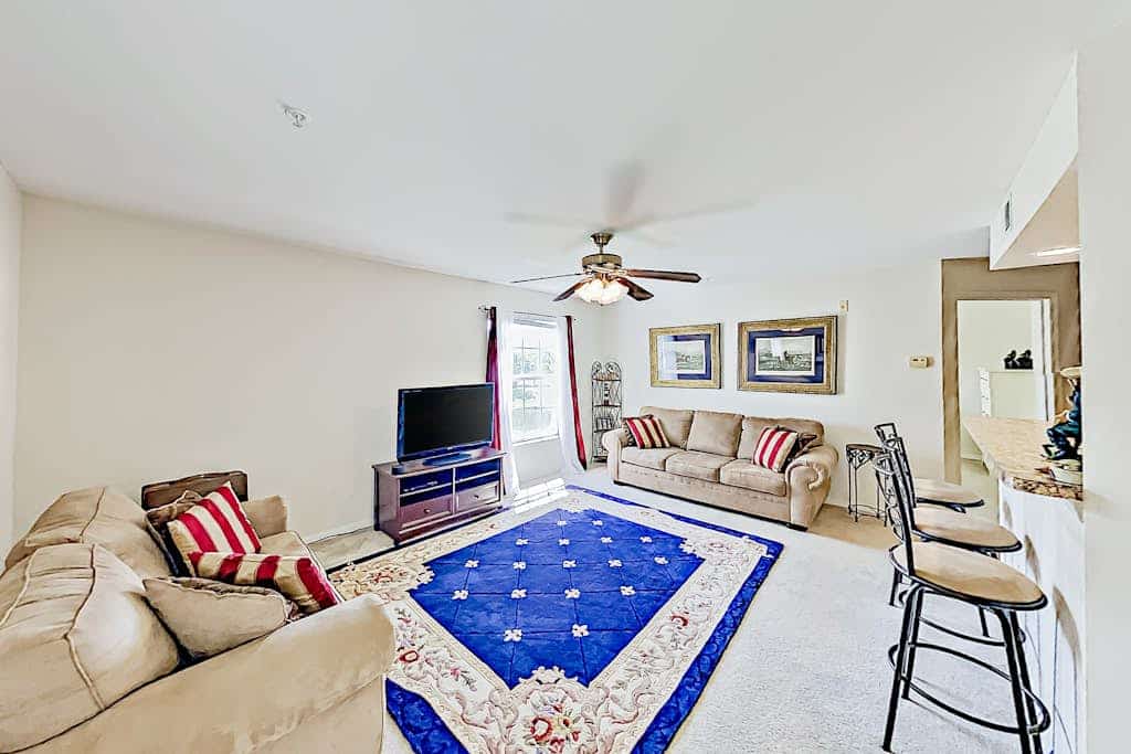 Dog-friendly lake-view getaway with pool & all-suite layout - walkable locale