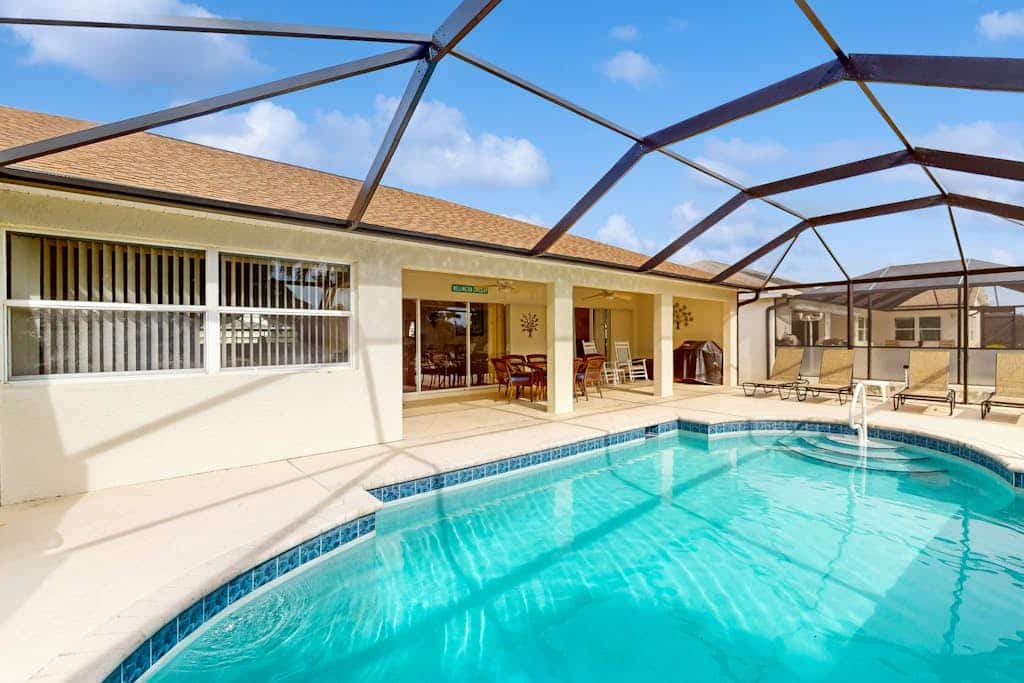 Spacious Lakefront Home with a Screened-In Pool in Exclusive Community