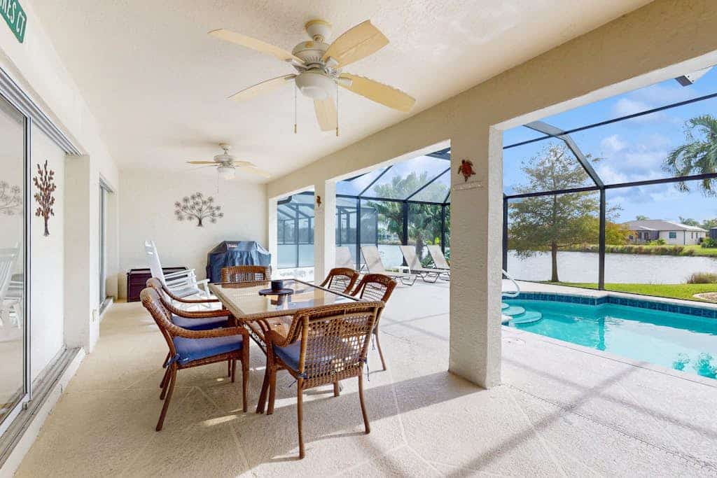 Spacious Lakefront Home with a Screened-In Pool in Exclusive Community