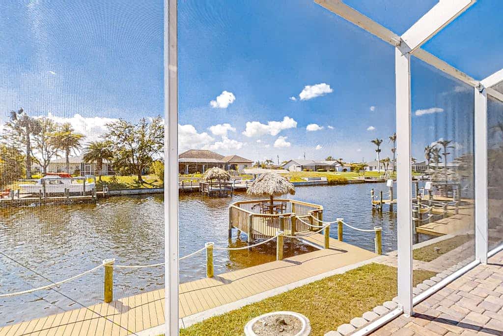 Canal-front home with pool, outdoor kitchen, & private dock - dog-friendly