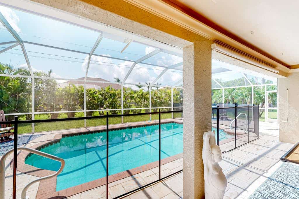 Inviting home with pool, water view, enclosed yard, central AC, W/D
