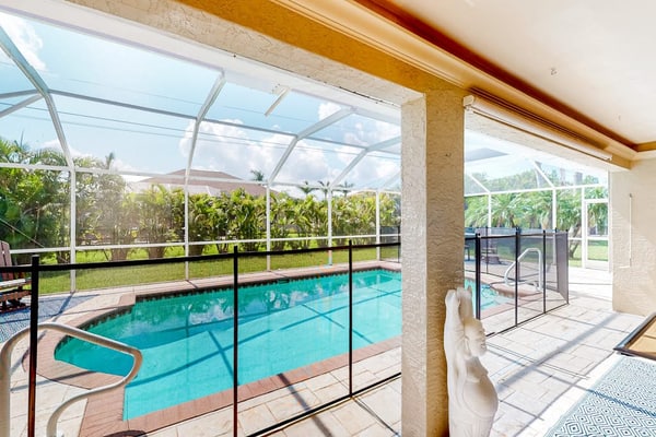 Inviting home with pool, water view, enclosed yard, central AC, W/D