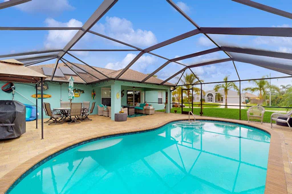 Dog-friendly home with private heated saltwater pool, patio, grill, & streaming