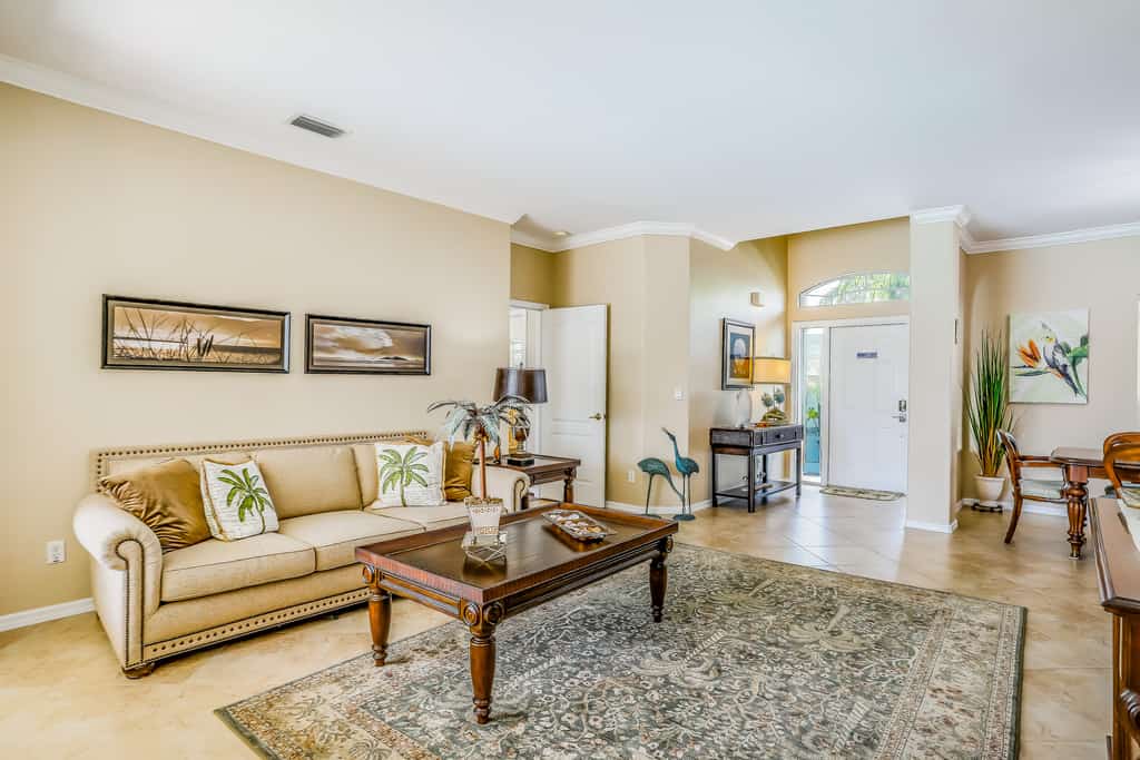 Spacious home with screened-in pool & lush lakefront views - minutes to beaches