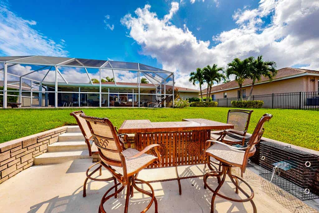 Inviting dog-friendly home with pool, water view, central AC, & W/D