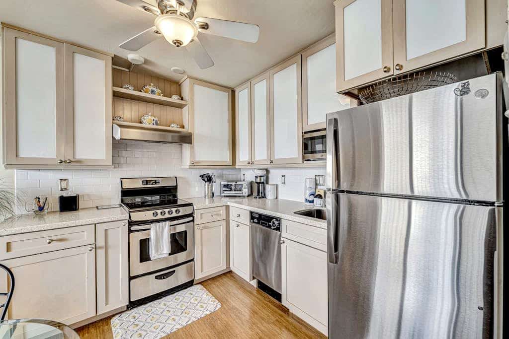 Waterfront condo with private beach area, pool, hot tub, grills, & balcony