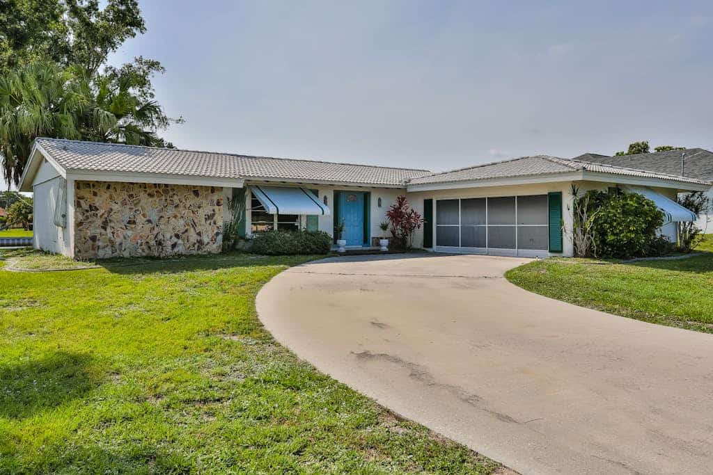 Relax, Work, or Play  in this Retro Waterfront Home with Sunsets & Private Dock