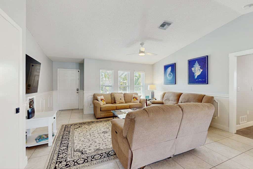 Snowbird-friendly home with private pool, water views, patio & sunroom