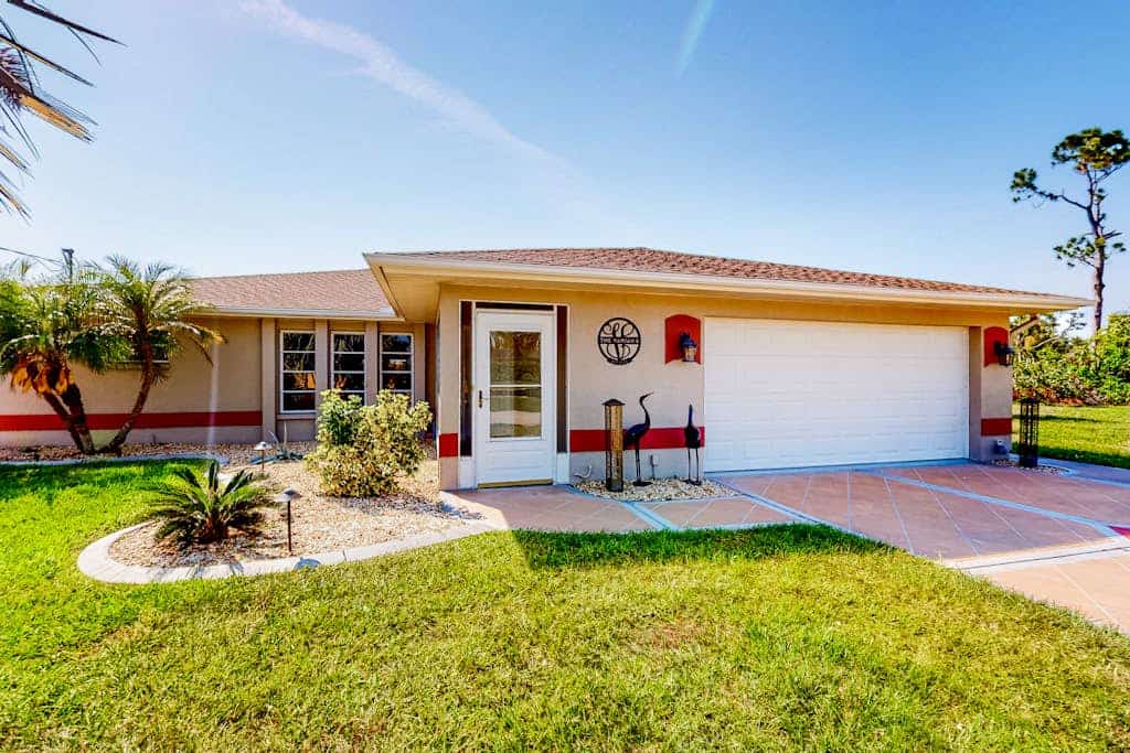 Snowbird-friendly home with private pool, water views, patio & sunroom