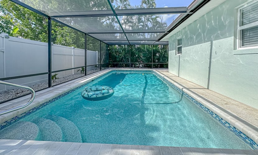 Bright and airy home with enclosed pool, hammock, and open-concept interior