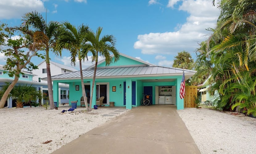 Single-story home with private yard, AC, & W/D - walk to beach, & dog-friendly