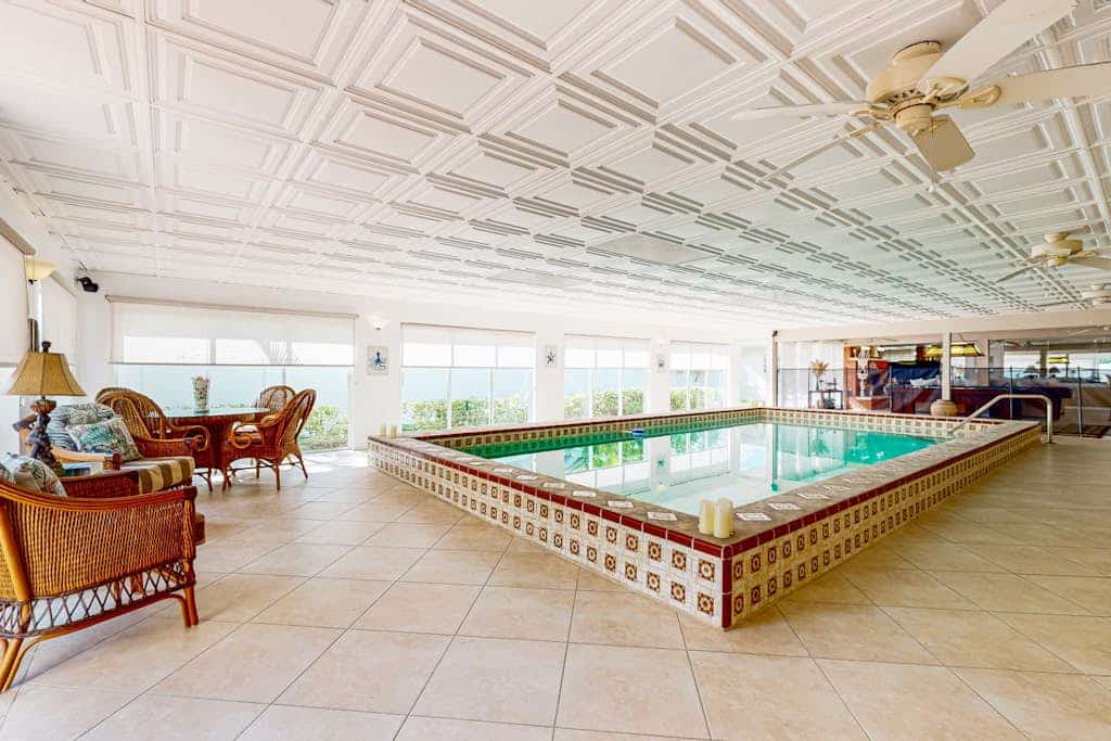 Luxurious single-level retreat w/ indoor pool, game room, and modern comforts
