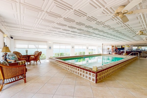 Luxurious single-level retreat w/ indoor pool, game room, and modern comforts