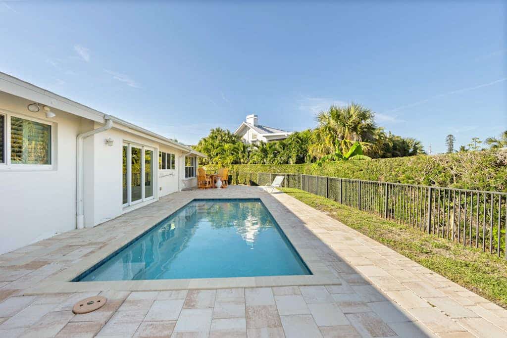 Snowbird-friendly home near water with private heated pool, grill, patio, & W/D