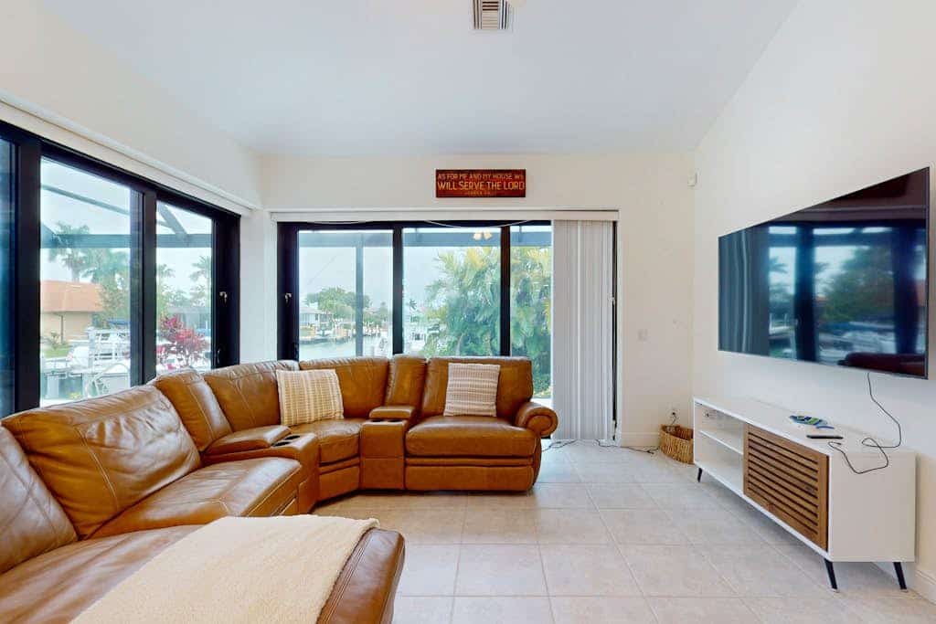 Canal-front home with private pool, pool spa, dock, boat access, grill, gym, W/D