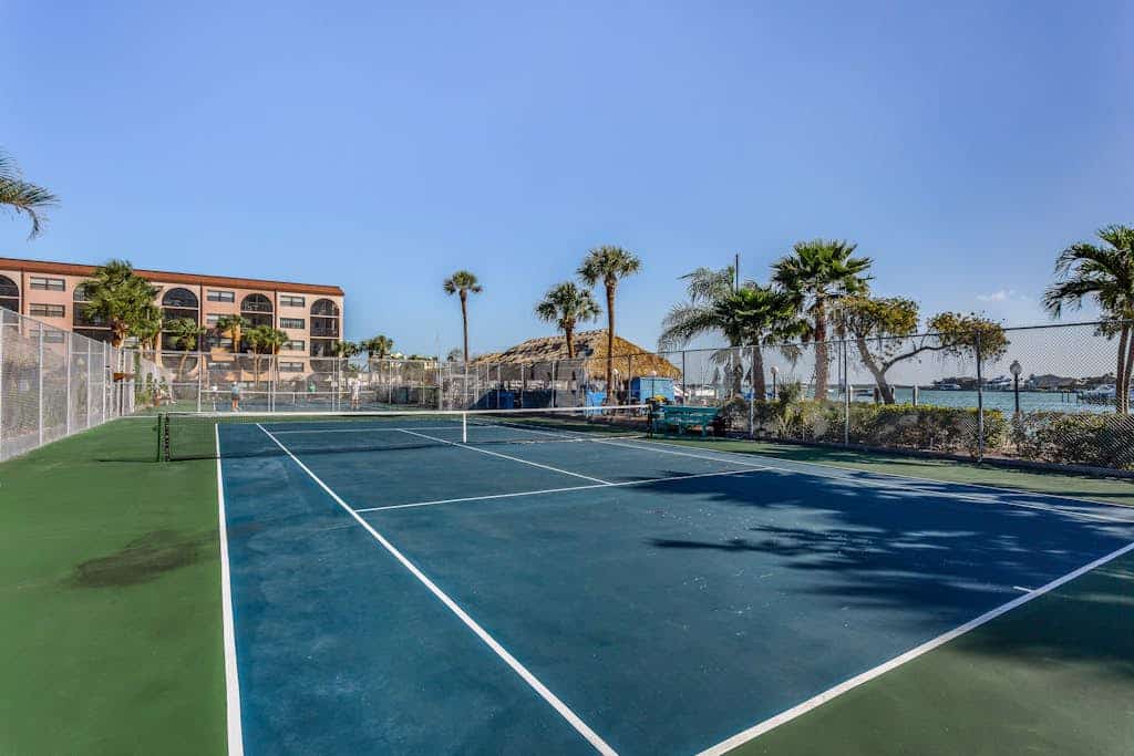 Snowbird-friendly condo with hot tub, outdoor pool, tennis, dock, BBQ, & balcony