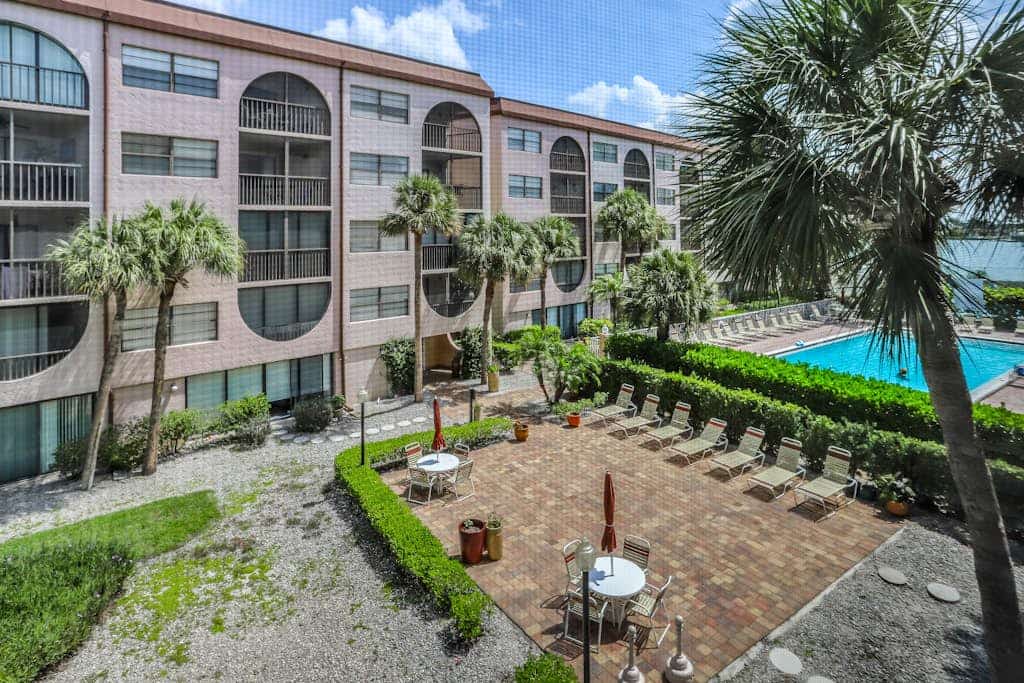 Snowbird-friendly condo with hot tub, outdoor pool, tennis, dock, BBQ, & balcony