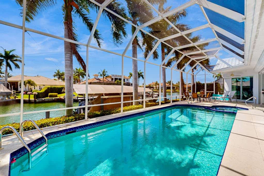 Dog-friendly waterfront getaway with lanai, private pool, & pool spa