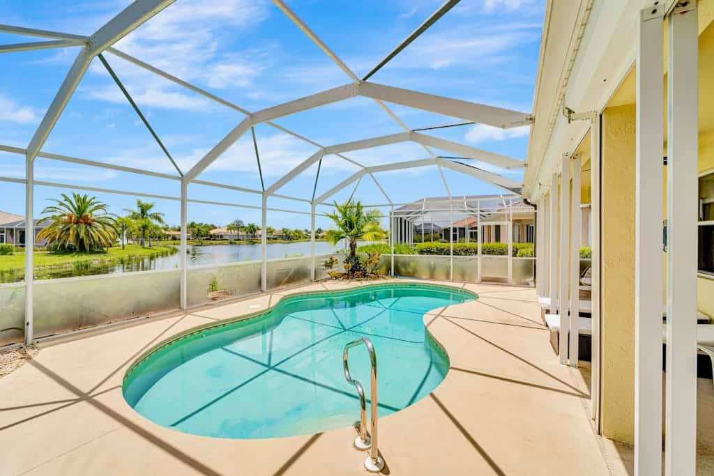 Country club retreat with private pool, water views, on-site golf, & gym