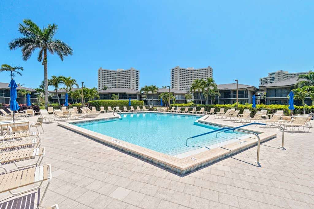 Waterfront condo with bay views, pool, tennis, pickleball, beach, & dock access